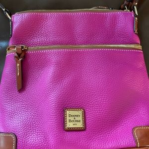 Dooney and Bourke pebble grain crossbody bag in hot pink.